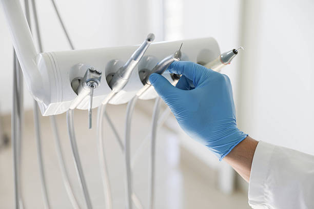 Professional Root Canal Treatment technician working in Burleson County County, TX